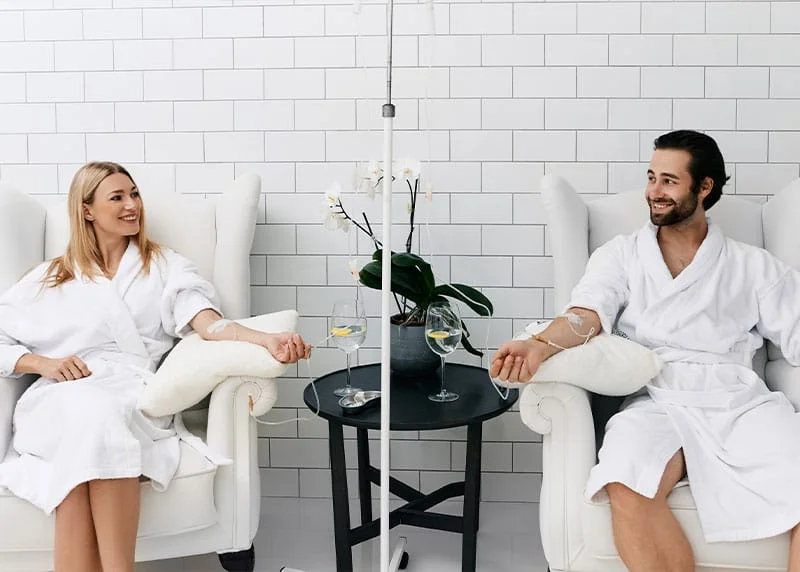 Couple in Fort Myers receiving IV therapy at NewU Wellness.